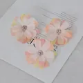 Three small artificial daisy flower heads with pink and yellow gradient fabric petals - Light Pink