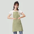 Professional green and white striped waterproof kitchen apron worn by female model - Breathable Cotton Linen Striped / 1 Piece / Pale Green