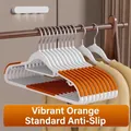 White and orange non-slip plastic hangers for clothes with space-saving design - 5 Pieces / Vibrant Orange