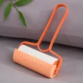 Orange portable lint roller with replaceable sticky roll for pet hair and clothing cleaning - With Lid / Orange
