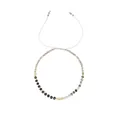 Detailed view of a minimalist Morse code beaded bracelet with adjustable white cord. - Black and Beige Mix (B2311-GO-D)