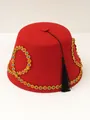 Detailed view of a red felt Fez hat with multi-colored gemstones and black tassel - Red