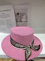 Close-up of pink flat-top straw hat with patterned paisley ribbon scarf - M (56-58cm) / Pink