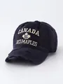 Detailed view of a vintage washed denim baseball cap with Canada maple leaf embroidery - Adjustable / Navy Blue