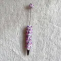 Detailed view of white beaded ballpoint pen featuring purple butterfly decorations - Pink Purple Gradient Butterfly Style (蝴蝶圆珠笔)