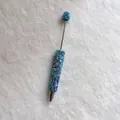 Detailed view of handmade blue rhinestone beadable pen with heart charms - Light Blue with AB Rhinestones