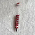 Detailed view of heavy craft beaded ballpoint pen with red butterfly and pearls - Solid Red Butterfly Style (蝴蝶圆珠笔)