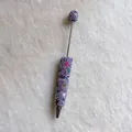 Macro view of handmade pen featuring purple rhinestones and colorful stone accents. - Light Purple with AB Rhinestones