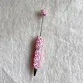 Close-up of decorative pink butterflies and pearls on a white beaded ballpoint pen - Solid Pink Butterfly Style (蝴蝶圆珠笔)