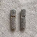 Close-up of 10ml portable perfume atomizer bottles covered in glittering AB rhinestones. - AB Color