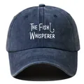 Close-up of vintage washed navy fishing hat with 'The Fish Whisperer' white print. - Navy Blue