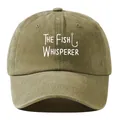 Close-up of a washed vintage baseball cap featuring a white Fish Whisperer slogan print. - Khaki