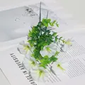 White artificial morning glory bouquet with yellow stamens and green leaves - White