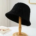 Handmade black woven bucket hat for summer sun protection displayed on a wooden stand - M (56-58cm) / Hollow Crochet Style (5633) / Black