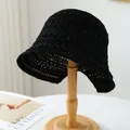 Handcrafted black straw bucket hat with breathable woven texture on a wooden stand - M (56-58cm) / Hollow Crochet Style (5642) / Black