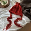 Vibrant red crochet knitted beanie with long tassels, warm winter hat for women. - M (56-58cm) / Embossed Tassel Style / Red