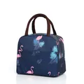 Insulated lunch bag featuring a pink flamingo print and sturdy brown carrying handles - Navy Flamingo
