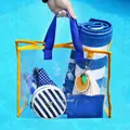 Stylish transparent PVC beach bag with blue handles and decorative lemon tassel keychain - Beach Bag (STB) / Blue and Yellow