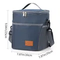 Blaue isolierte Oxford-Stoff-Lunchtasche mit verstellbarem Schultergurt und Maßen. - Marineblau