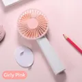 Close-up of the portable handheld USB fan in pink with a detachable base and accessory - N13 Base Model / Girl Pink