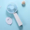 Portable handheld mini fan in sky blue color shown with its white detachable base - N13 Base Model / Sky Blue