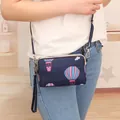 Navy blue crossbody phone bag with hot air balloon print and three zippers. - Navy Balloon (Shoulder Strap Style)