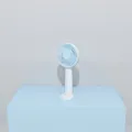 Minimalist portable USB rechargeable handheld mini fan in light blue for desktop use - Blue