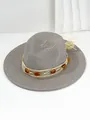 Detailed view of grey Panama straw hat with amber stone band decoration - M (56-58cm) / Gray