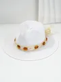 Close-up of white woven Panama straw hat featuring amber gem decorations. - M (56-58cm) / White