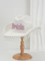Close-up detail of white wool cowboy hat with pink pearl Bride text and pearl fringe - M (56-58cm) / White with Pink Pearl Bride Italic