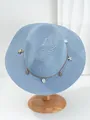 Detailweergave van lichtblauwe Panama strohoed met zeester en schelphangers voor het strand - M (56-58cm) / Haze Blauw