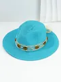 Detailed view of turquoise Panama straw sun hat with amber-colored resin beads - M (56-58cm) / Mint Blue