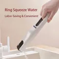 Hand squeezing water from a white handheld mini sponge mop over a bathroom sink. - Mop Handle Only (Without Sponge Head)