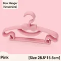 Stapel kleiner rosa Schleifen-Kinderkleiderbügel aus Kunststoff, Größe 28,5 x 15,5 cm - Schleife-Stil / Rosa