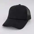 Macro view showing the mesh and foam structure of a classic solid black trucker cap - M (56-58cm) / Black