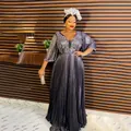 Elegant shimmering African evening dress with deep V-neck and pleated long skirt detail. - L / Dresses / Purple-Blue