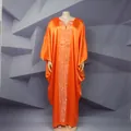 Detail view of bright orange African kaftan maxi dress with silver Greek key embroidery - One Size / Dresses / Orange