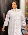 Detailed view of white African style lace maxi dress with intricate hollow-out embroidery - One Size / Dresses / White