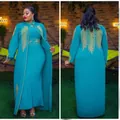 Detailed view of African 2-piece teal dress with gold rhinestone feather patterns - Top And Bottom / Emerald Green