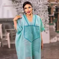 Detail view of mint green African oversized two-piece set with embroidery - One Size / Top And Bottom / Light Blue