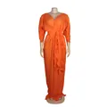 Macro view of orange pleated fabric and ruffle detail on elegant maxi dress - One Size / Dresses / Orange