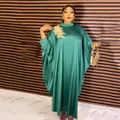 Detail view of African ethnic green rayon caftan dress featuring gold floral applique - Dresses / Ocean Green