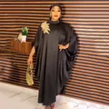 African style black rayon maxi dress with batwing sleeves and gold floral applique detail. - Dresses / Black