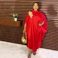 Elegant red African kaftan dress featuring a gold floral applique and stylish batwing sleeves - Dresses / Red