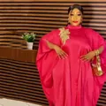 Detailed view of hot pink African ethnic kaftan dress featuring gold floral embroidery accents - Dresses / Rose Red