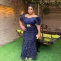 Detailed view of the luxury 3D floral embroidery and sequin boat neck evening gown. - L / Dresses / Navy Blue