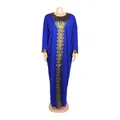 Royal blue African style long dress with intricate gold embroidery detail on mannequin - One Size / Dresses / Navy Blue