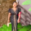 Close-up of elegant African black mesh dress with rhinestone detailing and puff sleeves - L / Dresses / Black