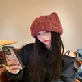 Reddish-brown knitted cat ear beanie for women, cute winter warm hat shown on model - Metal Label Style / Wine Red with Metal Label / 58-63