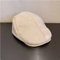 Detailed view of a stylish vintage beige suede ivy cap for a minimalist retro look - M / Beige